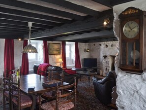 Living room with dining area | Porth Colmon Farmhouse, Porth Colmon, near Pwllheli