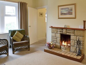 Welcoming open-fire within living room | Blairhosh Cottage, Balloch, Loch Lomond