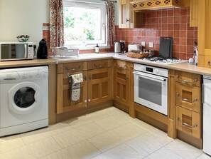Kitchen overlooking the garden | Capelrig Cottage, Balfron, near Drymen Loch Lomond & The Trossachs