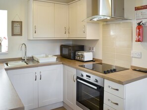 Well-equipped fitted kitchen | Westview Cottage, Seahouses