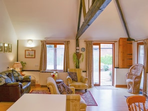 Comfortable open plan living area with exposed woodwork | Church Farm Studio, Surlingham
