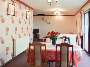 Lovely dining room by the oatio doors affording fine garden views | Elm View - Elm Cottages, Cwmbach, near Whitland