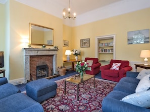 Attractive living room with an open fire | The Old Butlers House, Cley-next-the-Sea