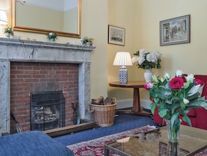 Attractive living room with an open fire | The Old Butlers House, Cley-next-the-Sea