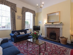 Attractive living room with an open fire | The Old Butlers House, Cley-next-the-Sea