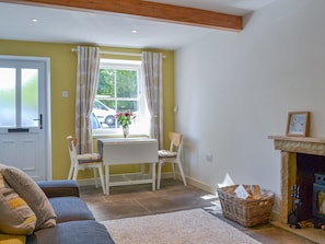 Beamed living area with woodburner | Clarence Cottage, Appleby-in-Westmorland