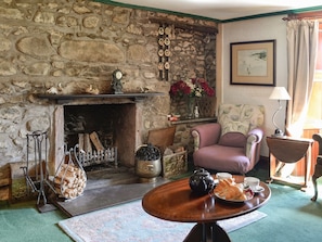Characterful living room with an open fire | Dalvanie Mill, Folda, Glenisla