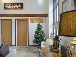 Traditional,seasonally decorated tree within the living room during the festive period | Hendre Barn Mawr, Abergynolwyn