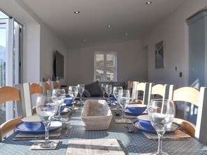 Dining area with a large banquet-style dining table | Pear Tree Cottage and The Granary, East Witton, near Leyburn