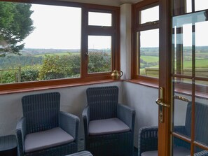 Conservatory with great views over the countryside | The Stables, Carthamartha, near Launceston