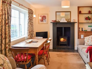 Cosy and comfortable living/dining room | St Cadoc Cottage, Harlyn Bay, near Padstow