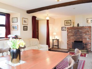 Living/dining room with feature fireplace | The Blacksmith Shop, Shorwell