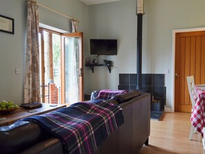 Living room with wood-burning stove | The Stables - Higher Farm, Martin, Fordingbridge