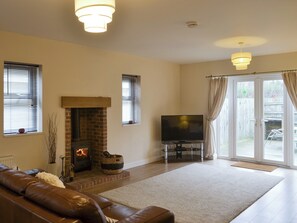 Welcoming living area with wood burner | Abbey Cottage, Longhirst, near Morpeth