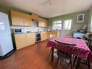 Well-equipped kitchen with dining area | April Cottage, Clay Common, near Southwold