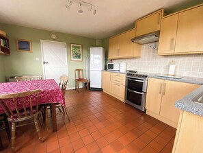 Fully appointed kitchen with dining area | April Cottage, Clay Common, near Southwold