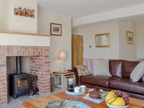 Delightful living room with cosy wood burner | Orchard Cottage, Upton Cressett, near Ironbridge