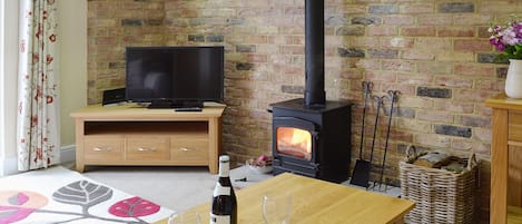 Comfortable living room with woodburner | Dairy Cottage, Pembury, near Tunbridge Wells