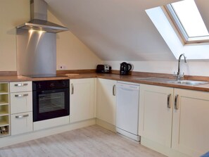 Galley style kitchen area | Meadow View - Hazel Grove Cottages, Red Roses, near Pendine