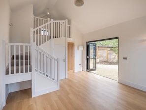 Large living area with stairs to mezzanine level | Badgers Sett Brook, Brook, near Brighstone