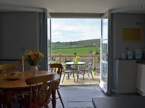 Kitchen/dining area with French doors leading to balcony | The Old Classroom, St Neot, near Liskeard