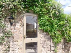 Attractive entrance from the patio area to the living area | The Hayloft, Edge Hills, near Littledean