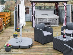 Relaxing, private hot tub area on terrace  | The Smithy, Little Witley, near Worcestershire
