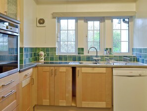 Fitted kitchen with oven built into fitted wooden units | Greenhedges, Budleigh Salterton