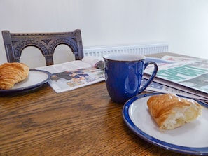 The modest dining area makes an excellent breakfast spot | Tuppence Cottage, Dulverton