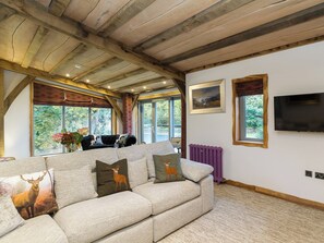 Cosy lounge area with wall mounted TV | Knock Old Castle, Largs