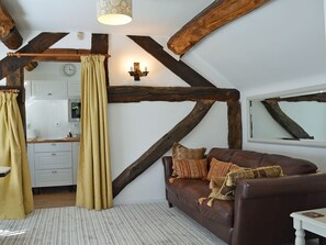 Cosy living/dining room with beams | The Beehive, Betley, near Nantwich