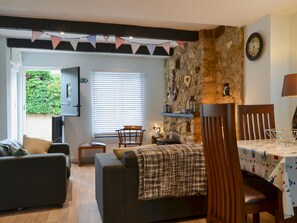 Living and dining area with wood burner | Horseshoe Cottage, Porchfield, near Cowes