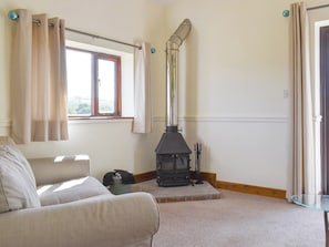 Welcoming living area with wood burner | The Old Dairy, Thorncombe, near Broadwindsor