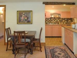 Modest dining area and adjacent kitchen | Burrow Farm Garden Retreat - Gardener’s Rest - Burrow Farm Gardens Retreat, Dalwood, near Axminster