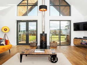 Outstanding living area with French doors to balcony | Strathspey Lodge, Duthil, Carrbridge, near Aviemore