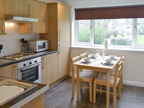 Well-equipped kitchen with dining area | Newquay Holiday Villa, Newquay