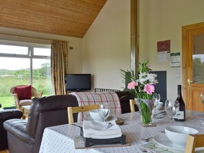 Dining area within open-plan living room | Riverview Cottage, Acharacle