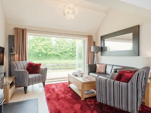 Spacious living room with opening doors with fantastic view | Canal View, Tetchill, near Ellesmere