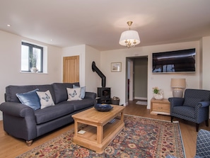 Cosy living space with wood burner | The Coach House - Old Downs Farm, Sandwich Bay, near Sandwich