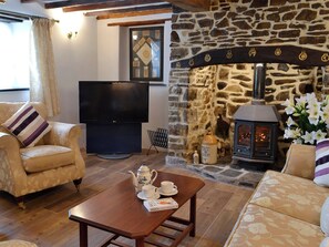 Comfortable living room with beams | Knotty Corner Cottage, Fairy Cross, near Bideford