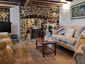 Comfortable living room with beams | Knotty Corner Cottage, Fairy Cross, near Bideford