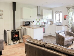 Delightful open plan living space with cosy wood burner | The Old Parlour, Whatlington, near Battle