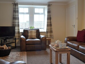 Cosy living room with wood burner | Browney Cottage, Lanchester, near Durham