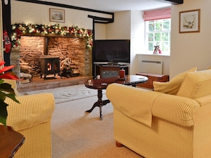 Living room with inglenook fireplace & wood burning stove | Karslake House, Winsford, near Dulverton