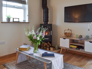 Open plan living space with wood burner | The Hayloft - Netherfield Hill Farm, Netherfield, near Battle