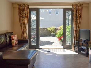 Open plan living space with French doors to patio | Old Church School, Plympton, near Plymouth