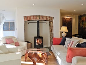 Cosy living room with wood burner | The Coach House, Chulmleigh, near South Molton