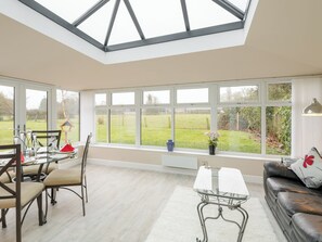 Light and airy conservatory/ dining area | Bay Cottage, Boughton, near Downham Market