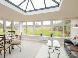 Light and airy conservatory/ dining area | Bay Cottage, Boughton, near Downham Market
