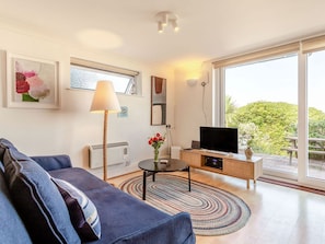 Living room with tv and sea views | Studio Sea Urchin, Carbis Bay, near St Ives
